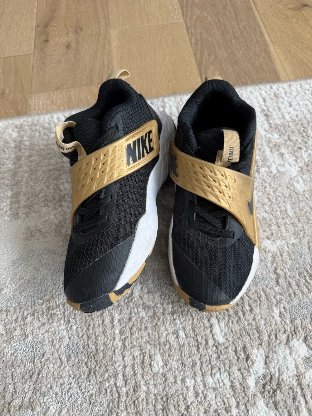 EUC Nike Kids Black and Gold Basketball Shoes
